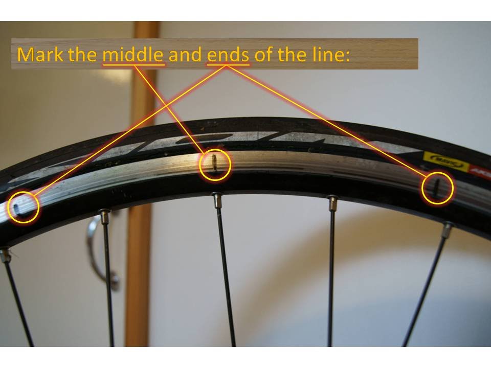 How to straighten a wheel rim on a bicycle