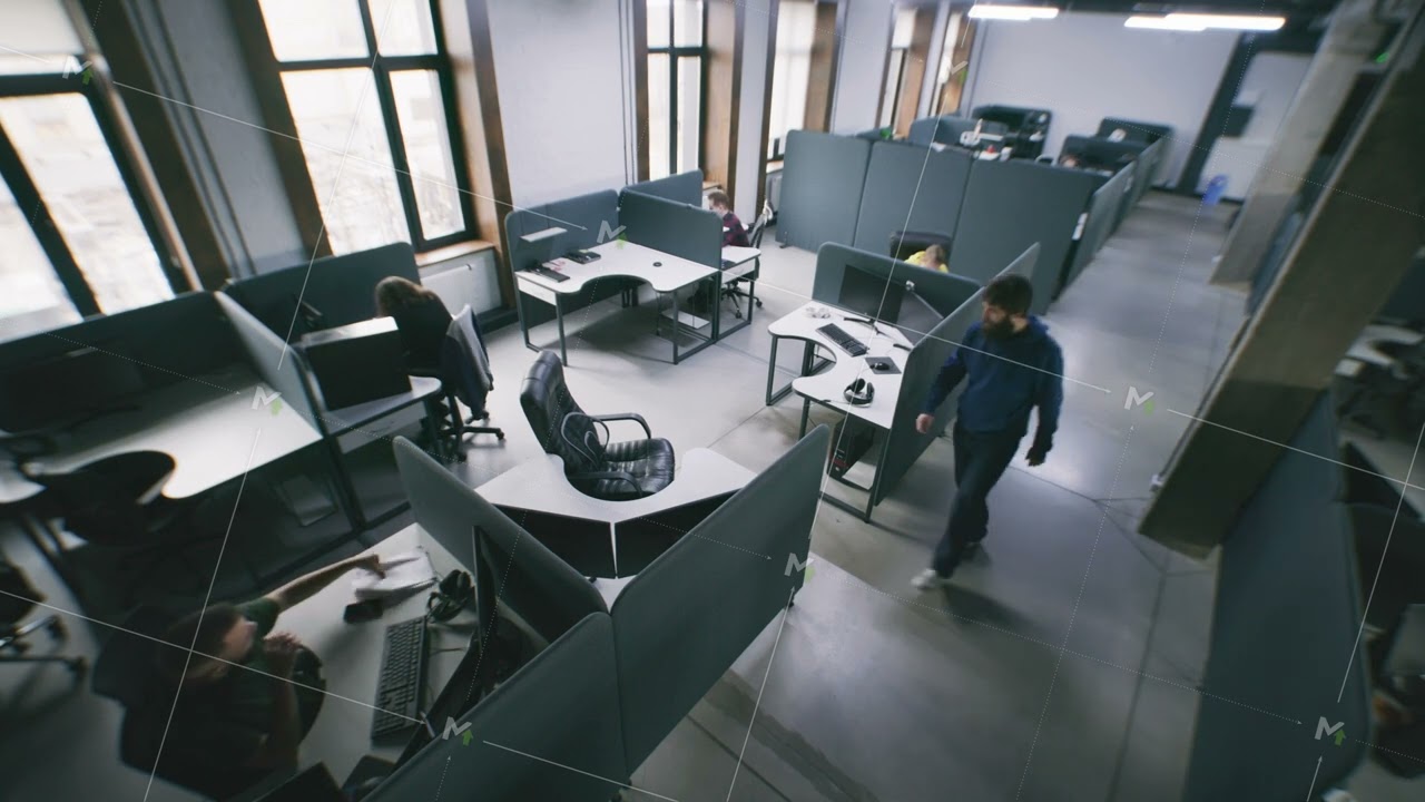 Security camera view of people working at office