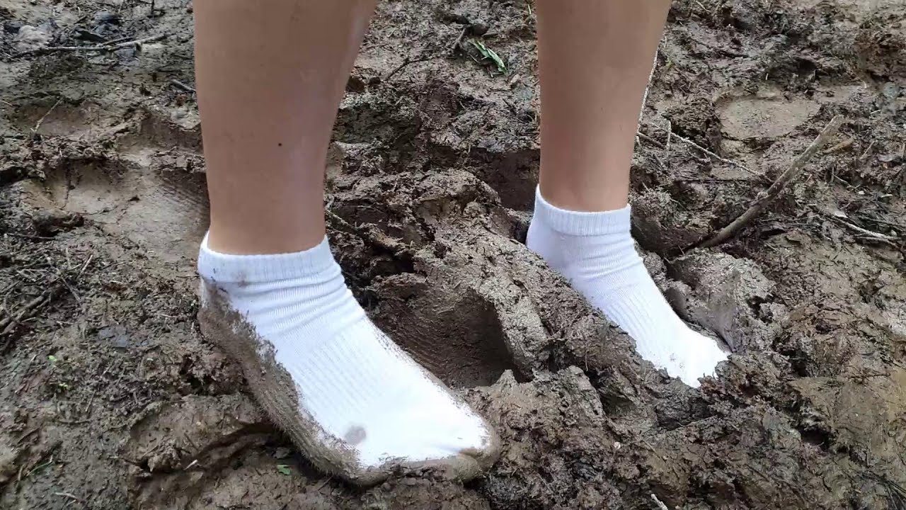 White socks in mud, dirty white socks, muddy white socks, muddy puddles socks walking (scene 560)