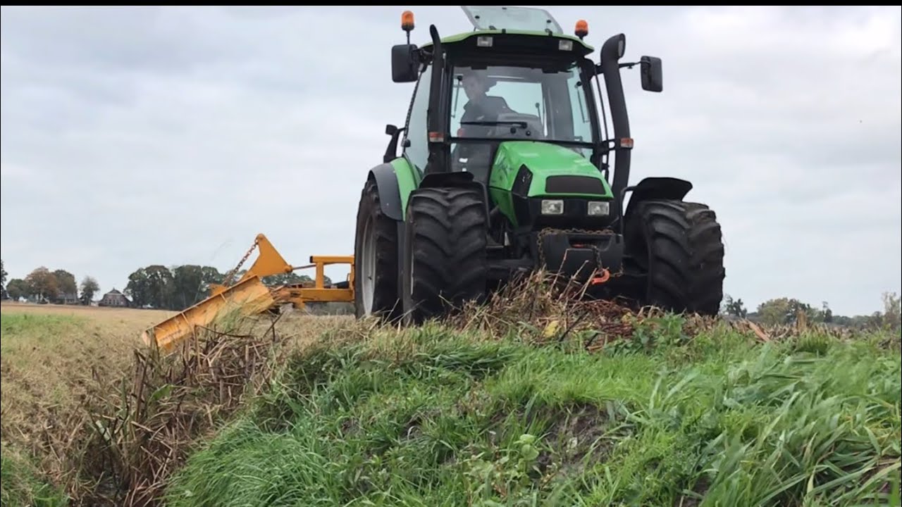 Mowing the ditches around the fields