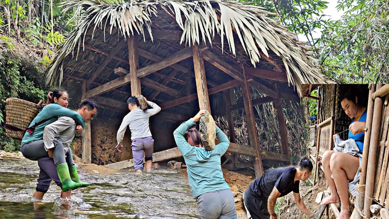 The couple build a new house in the forest - fix the pillars during heavy rain.