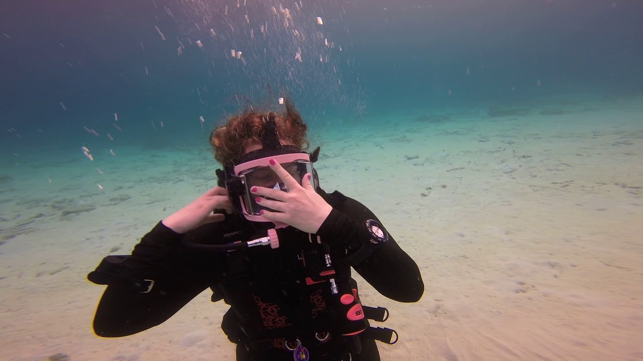 Amanda practicing switching from full face to normal dive mask with OTS Guardian in Bonaire