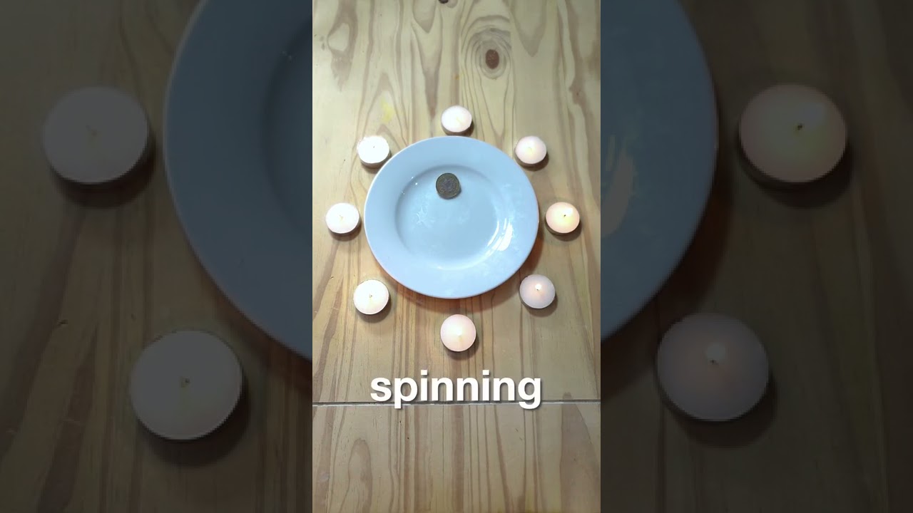 Person Spins Coin Without Touching It By Using Candles - 1189434