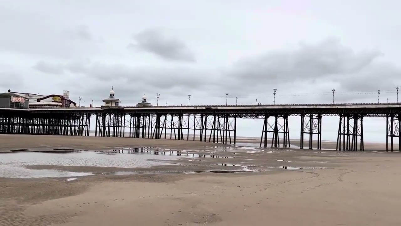 A Relaxing Stroll Under North Pier at Blackpool Beach