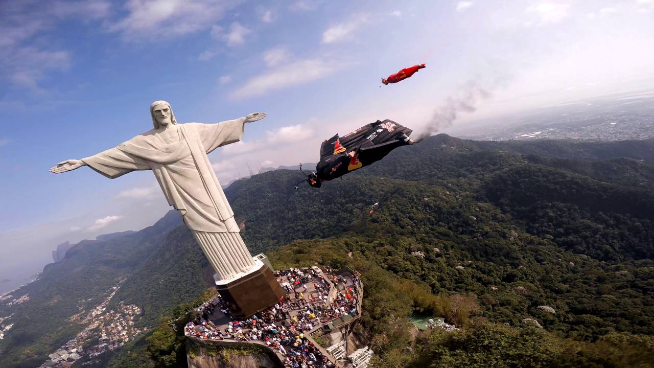 Jeb Corliss flying by Christ with friends