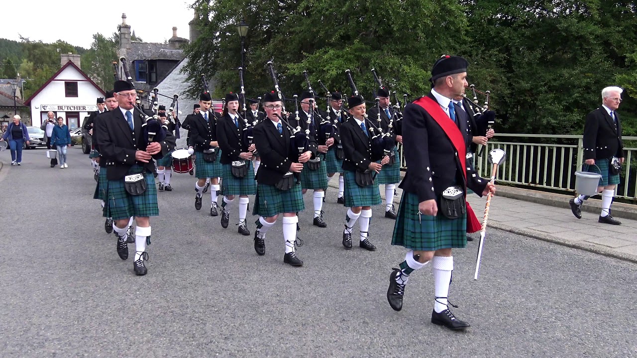 Newtonhill Pipe Band Parade through Braemar, Scotland during the Braemar Gathering weekend - 4K