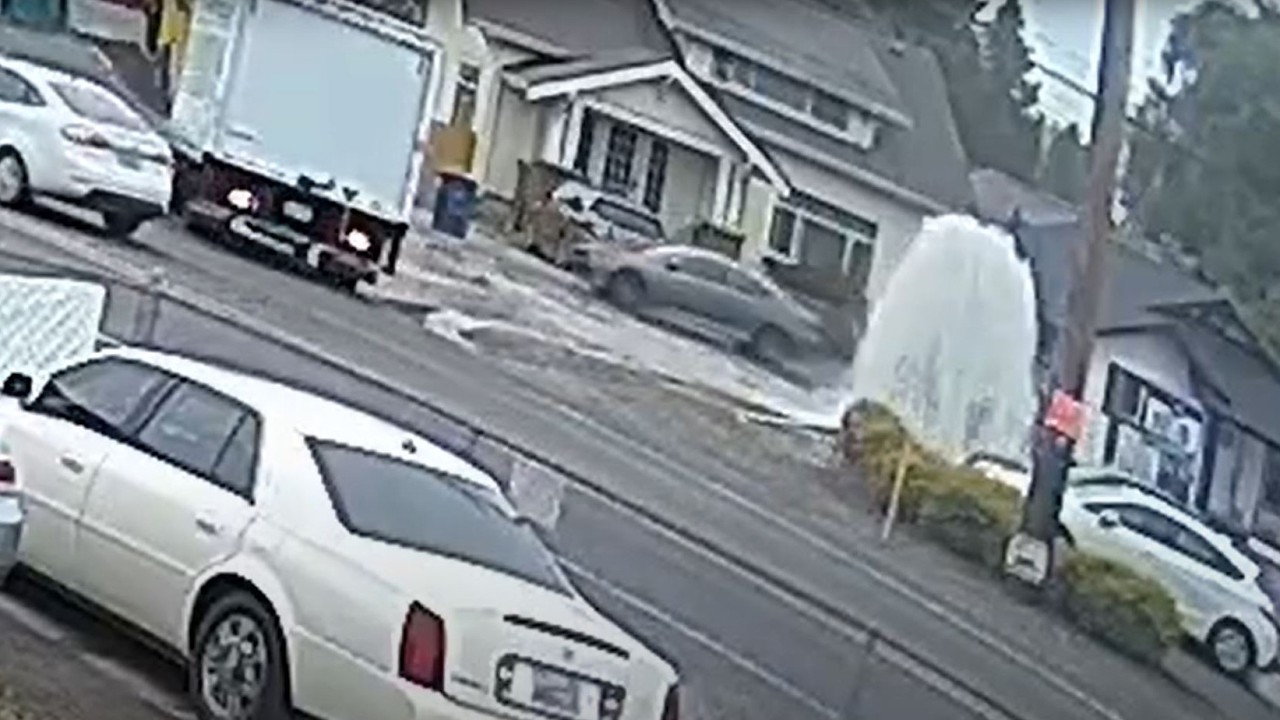 Semi-truck runs over fire hydrant
