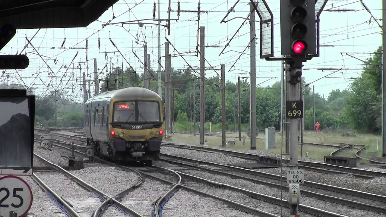FCC Class 365 departs Hitchin, crossing the junction to the Cambridge line