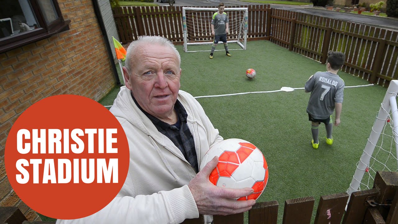Man builds mini-football stadium in grandsons' front yard so they don't get muddy