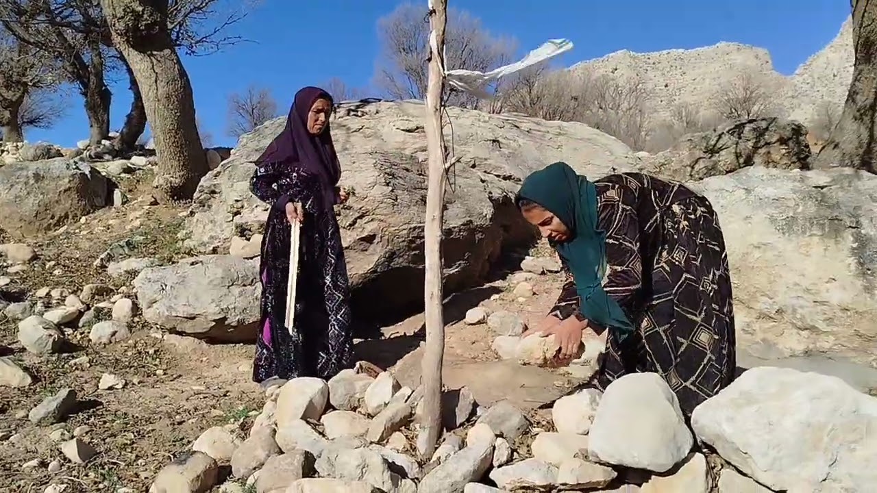 In the heart of the towering mountains, a nomadic   tired face and a guardian of hope