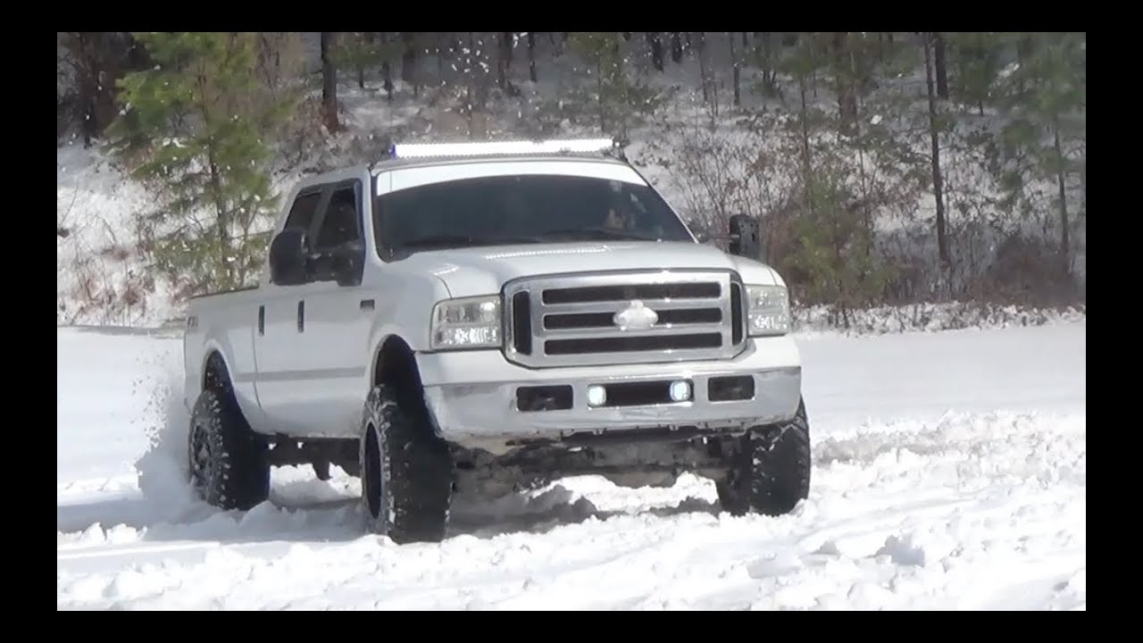 Lifted F250 Powerstroke Playing In The Snow