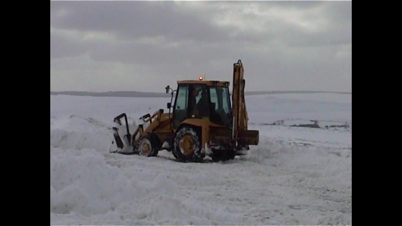 Cars stuck in drifting snow on A169. Digging the Goathland, Aidensfield road out of 20 feet drifts.