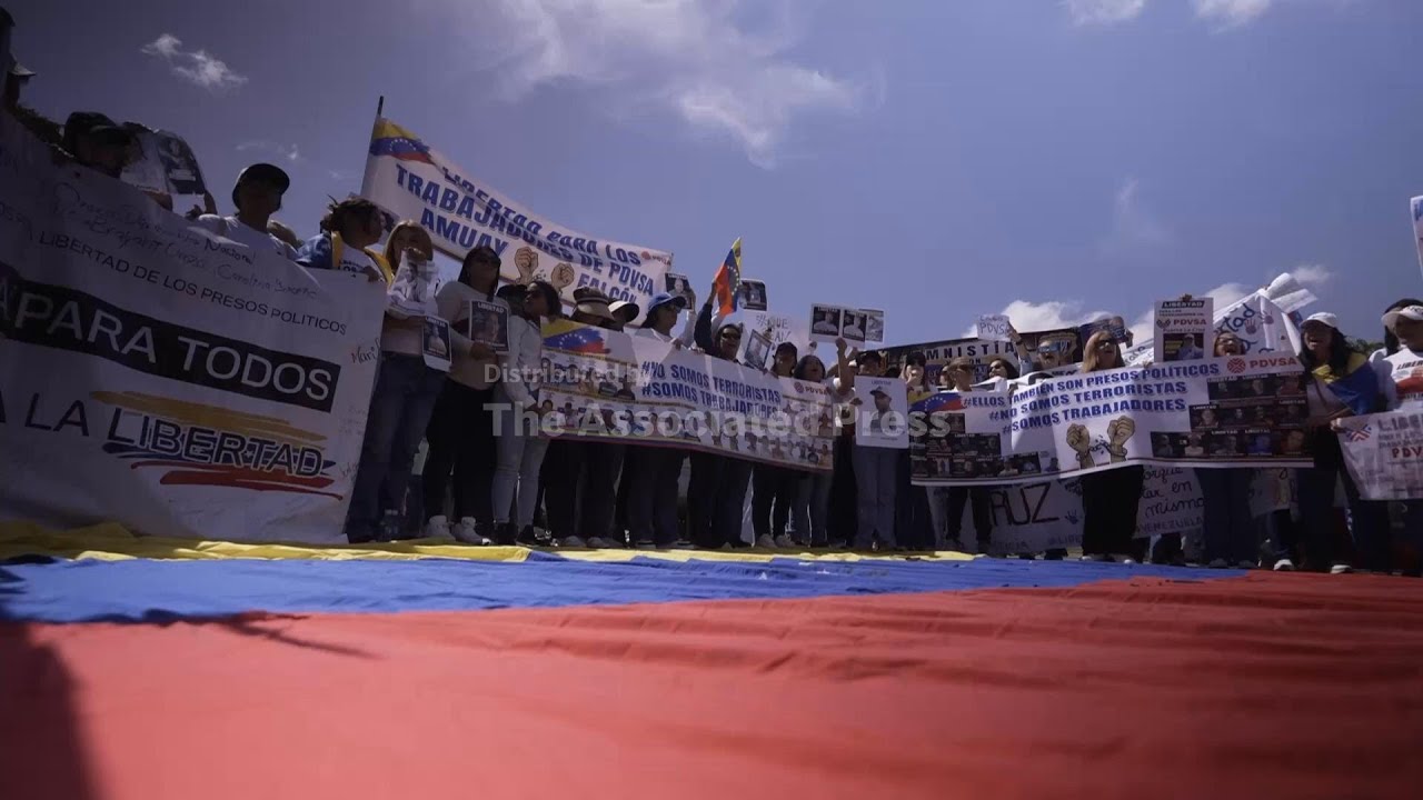 Released Venezuelan activists and their relatives protest to demand approval of amnesty bill