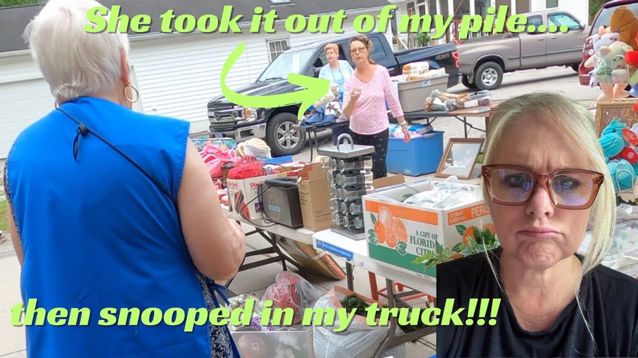 She took stuff out of my pile and then was snooping in our truck!!  Yard sale antics!!  LOL!!!