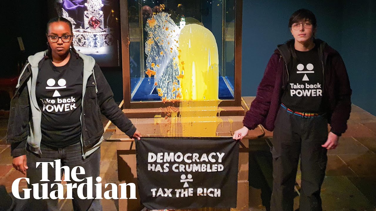 Activists throw apple crumble at crown jewels display case in Tower of London
