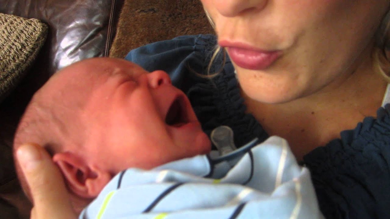 New Mother Comforts Child