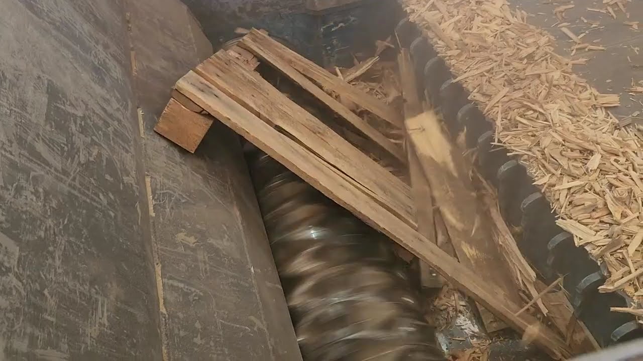 Shredding pallets with the Shark ES15.3 shredder.
