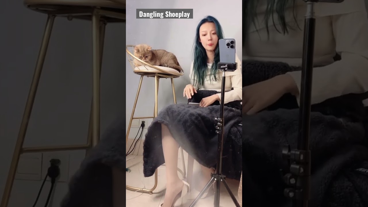 Dangling heels shoeplay with cat 