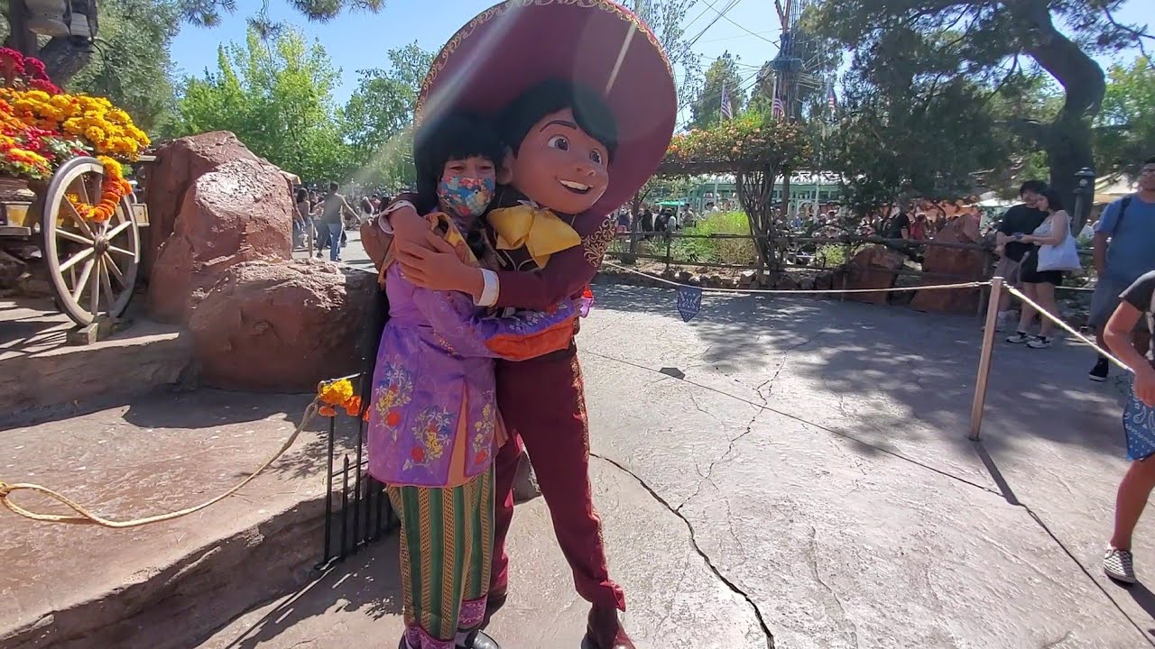 I as Berry Violet interacts with Miguel Rivera of Coco at Frontierland of Disneyland 2022