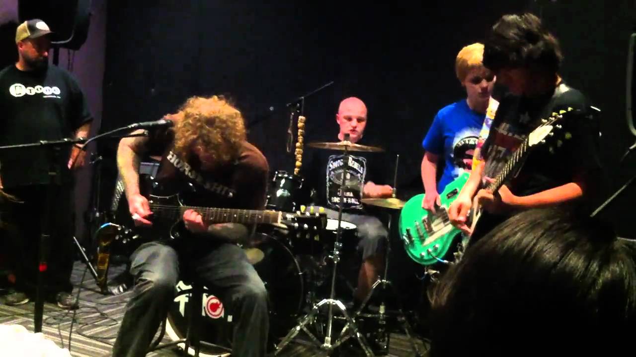 Brent Hinds of Mastodon performing with the School of Rock