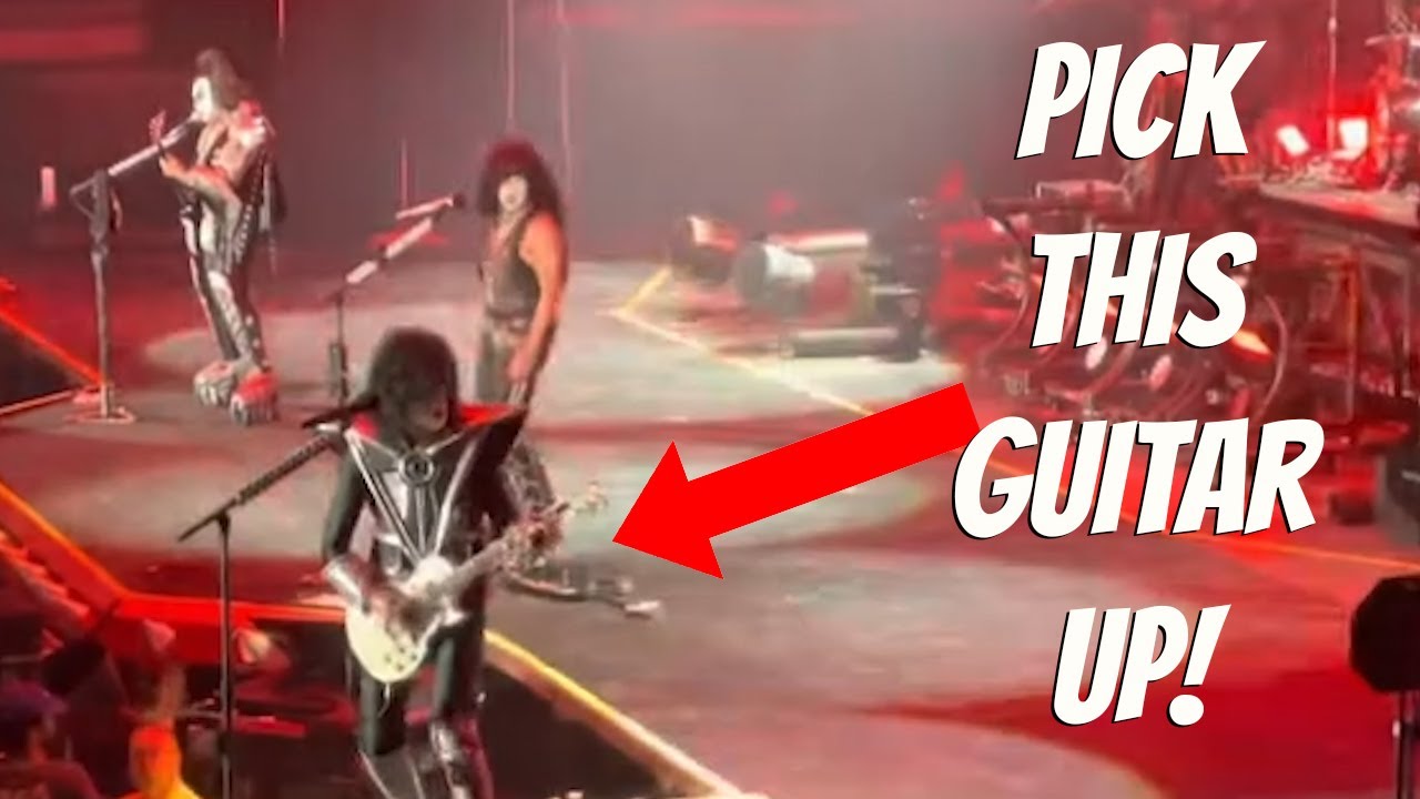 Paul Stanley is VERY upset with his guitar (and lips....)
