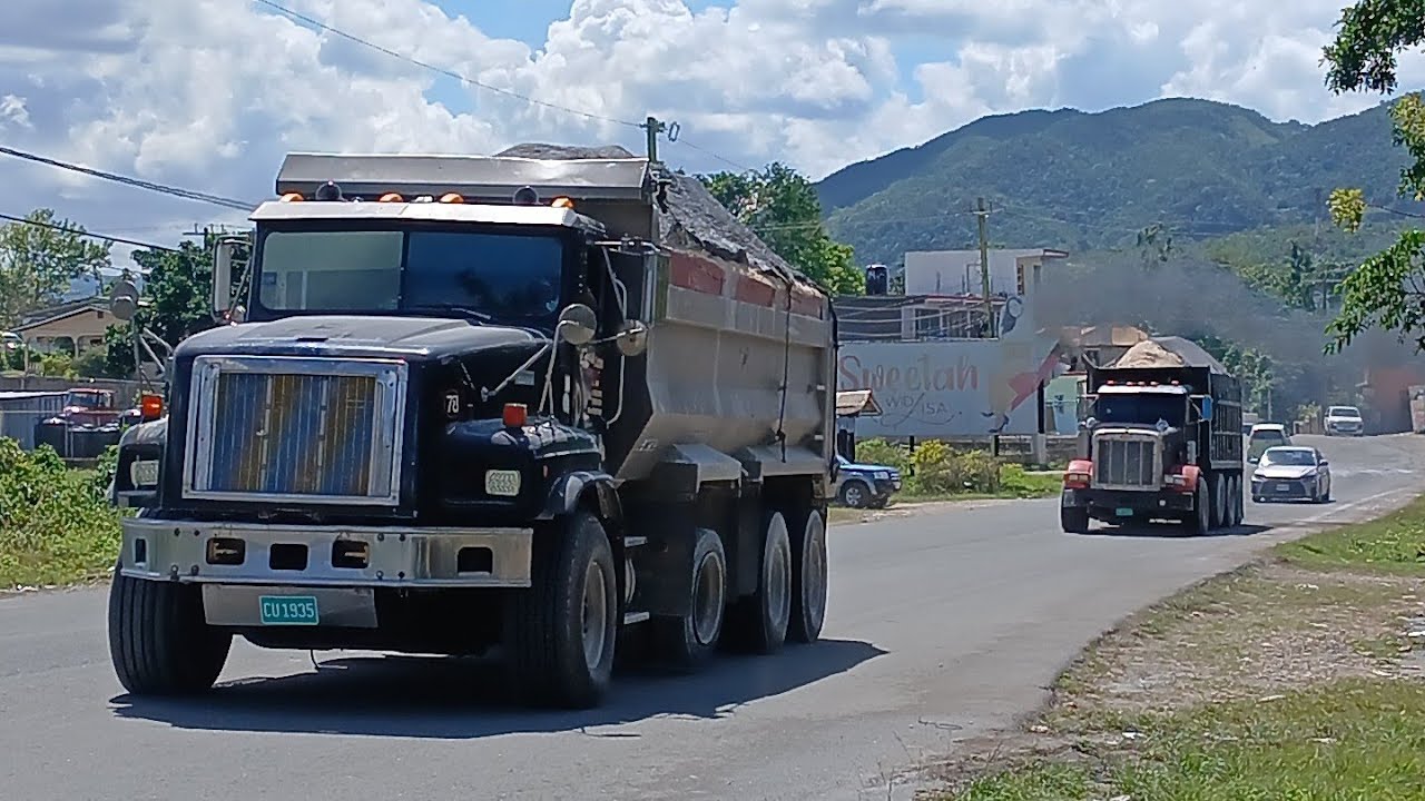 Loaded Trucks carrying heavy materials up hill 