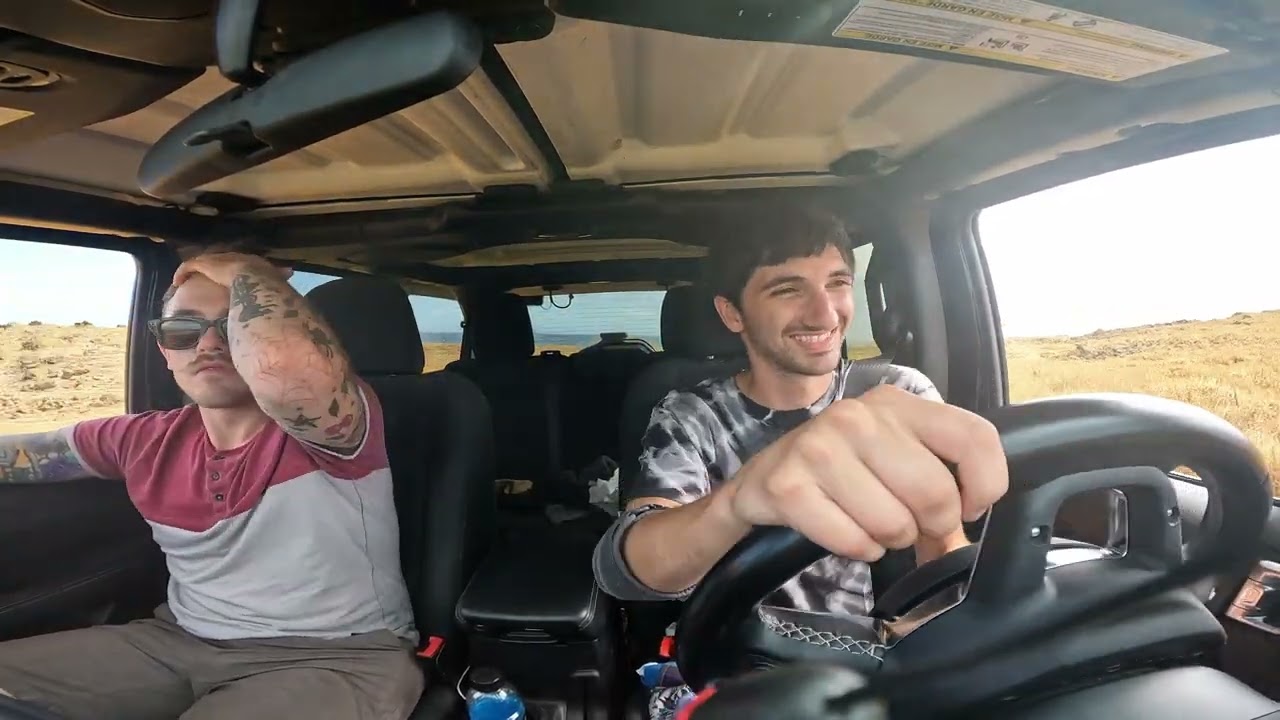 Driving a jeep to green sand beach Hawaii