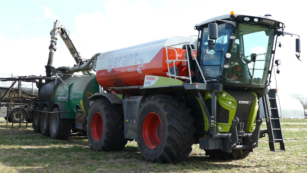 Claas Xerion 4000 SaddleTrac laying manure w/ Samson PG25 & 36-Meter Harsø Boom | DK Agri