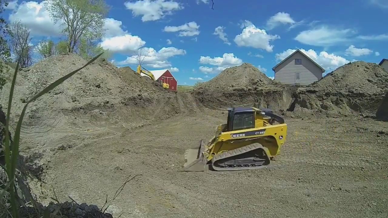 Deere CT332 skid steer grading clay