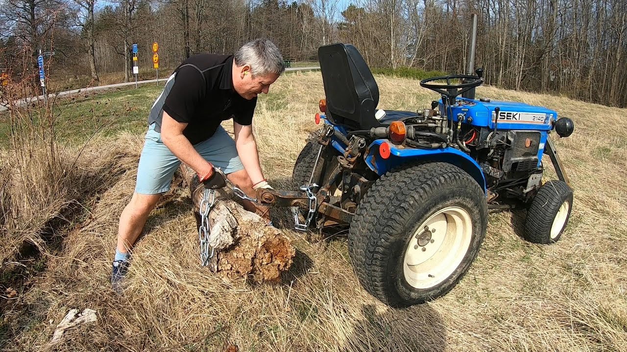 Dragging away a dead tree with Iseki TX 2140 4 WD