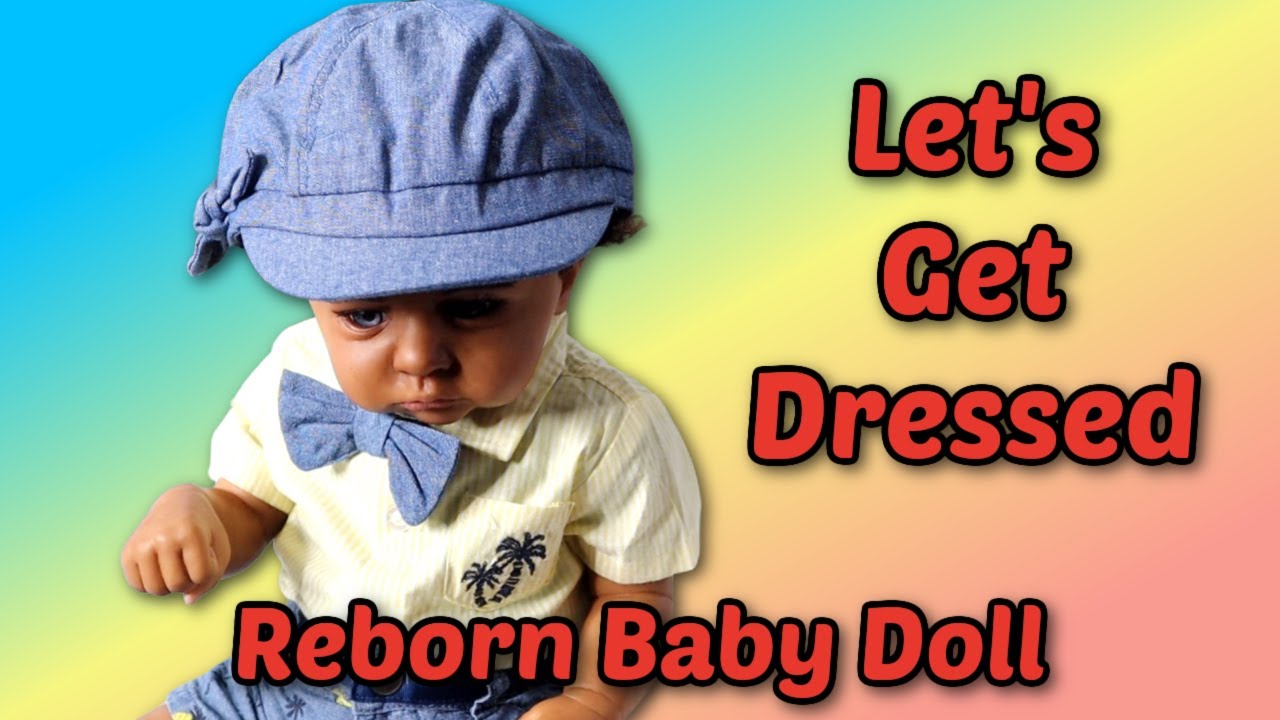 Dressing reborn baby boy Cameron in his outfit of the day