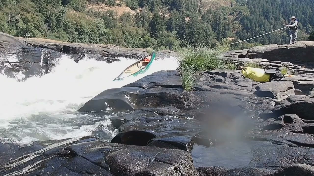 Solo canoe lining Sawyer's Rapid.