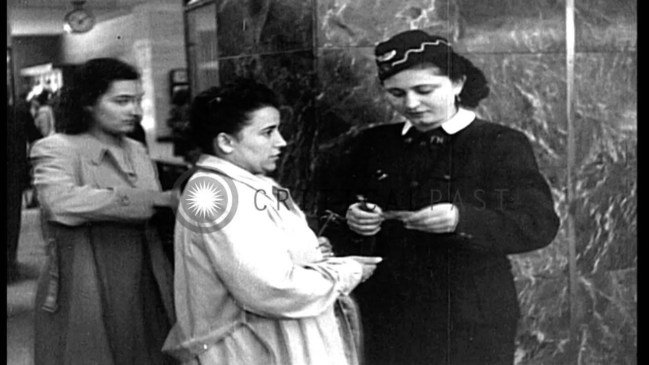 Women railroad workers check and collect tickets at railway station in Italy. HD Stock Footage