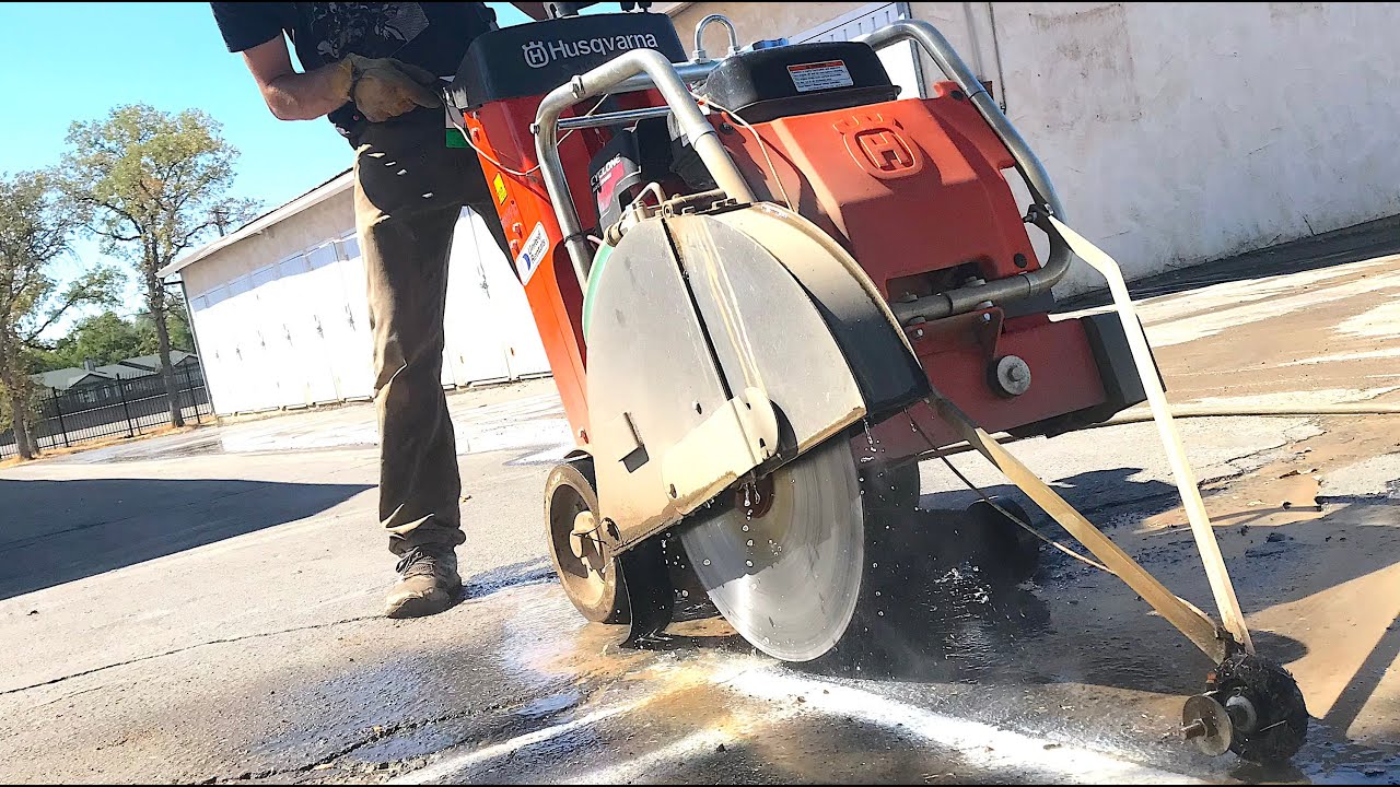 Cutting Asphalt and Trenching for New Conduit