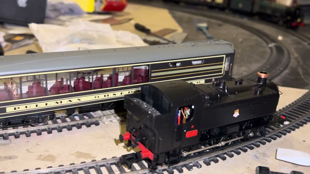 Bachmann  94XX shows its power on a 7 coach Pullman stock train plus a King hauls the rake