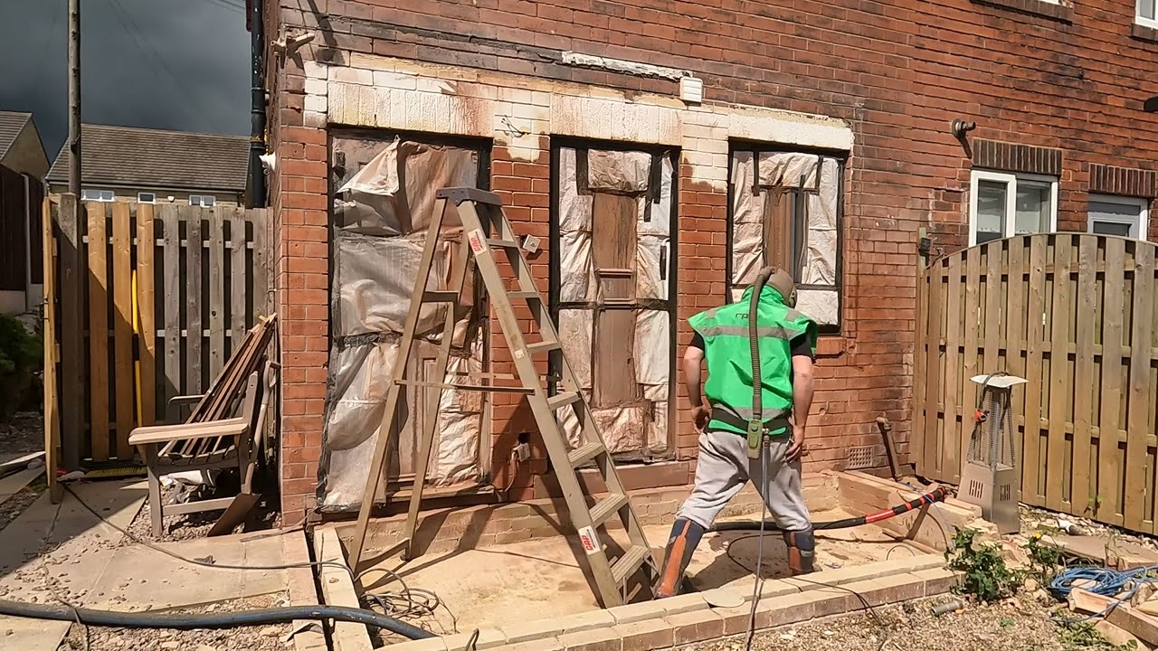 Removing paint from the rear of a house - Sandblasting