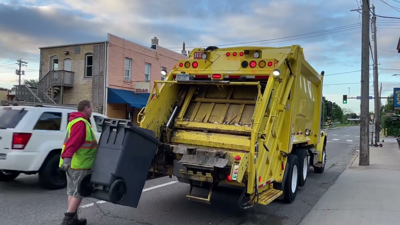 Yellow Heil Rear Loader With Euro Tippers