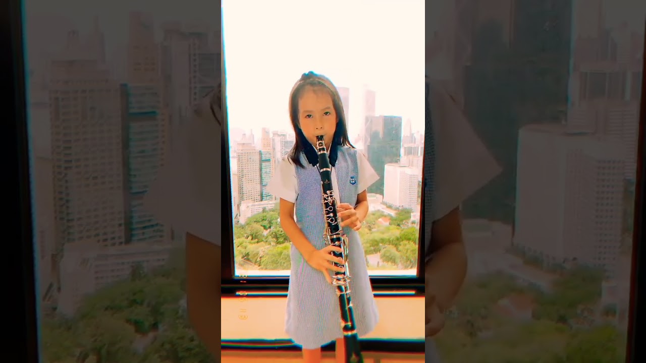 Little Chinese Girl Playing Clarinet