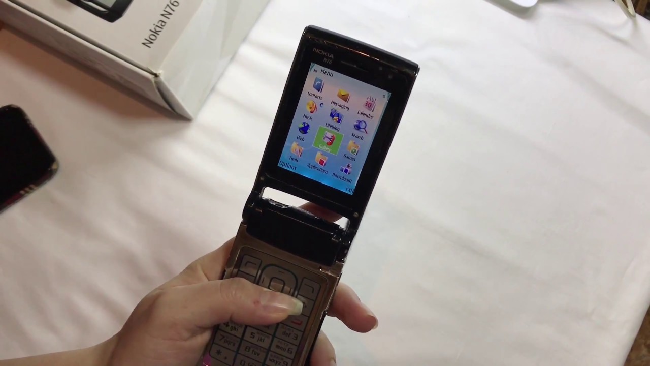 Nokia N76-1, Black, Smartphone in a stylishly slim flip-phone design