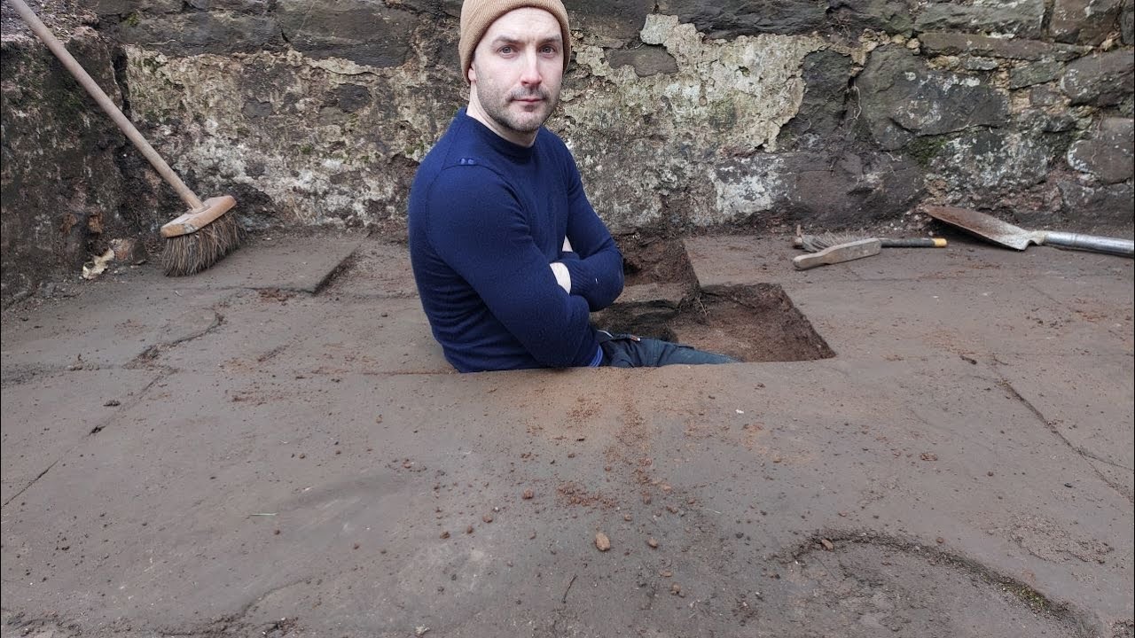 Digging under the floor of the ruins