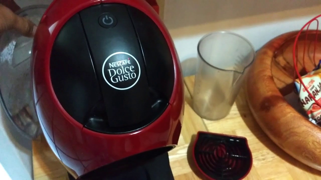 Cafetera DolceGusto proceso para descalcificar foco ambar naranja