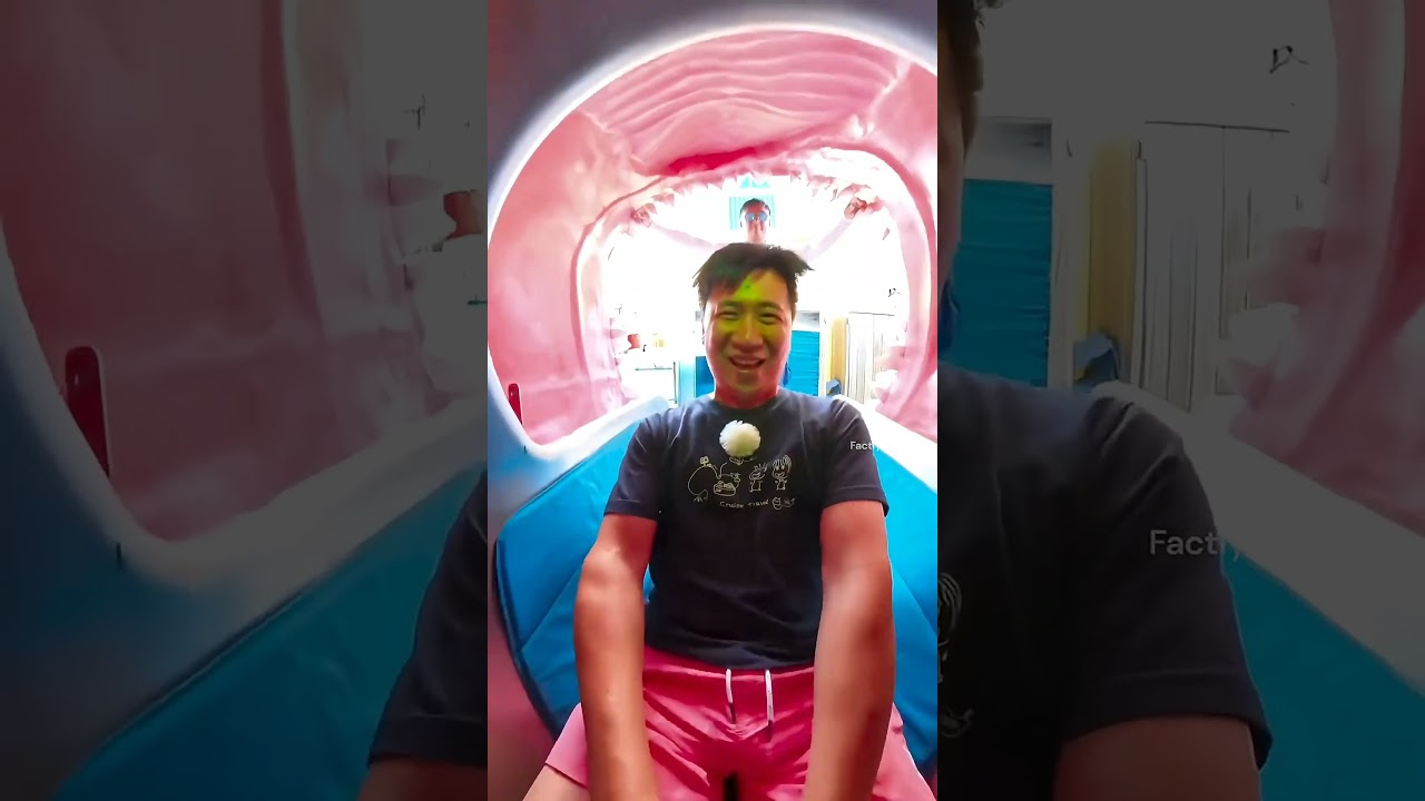 Boy stuck in dragon slide. 