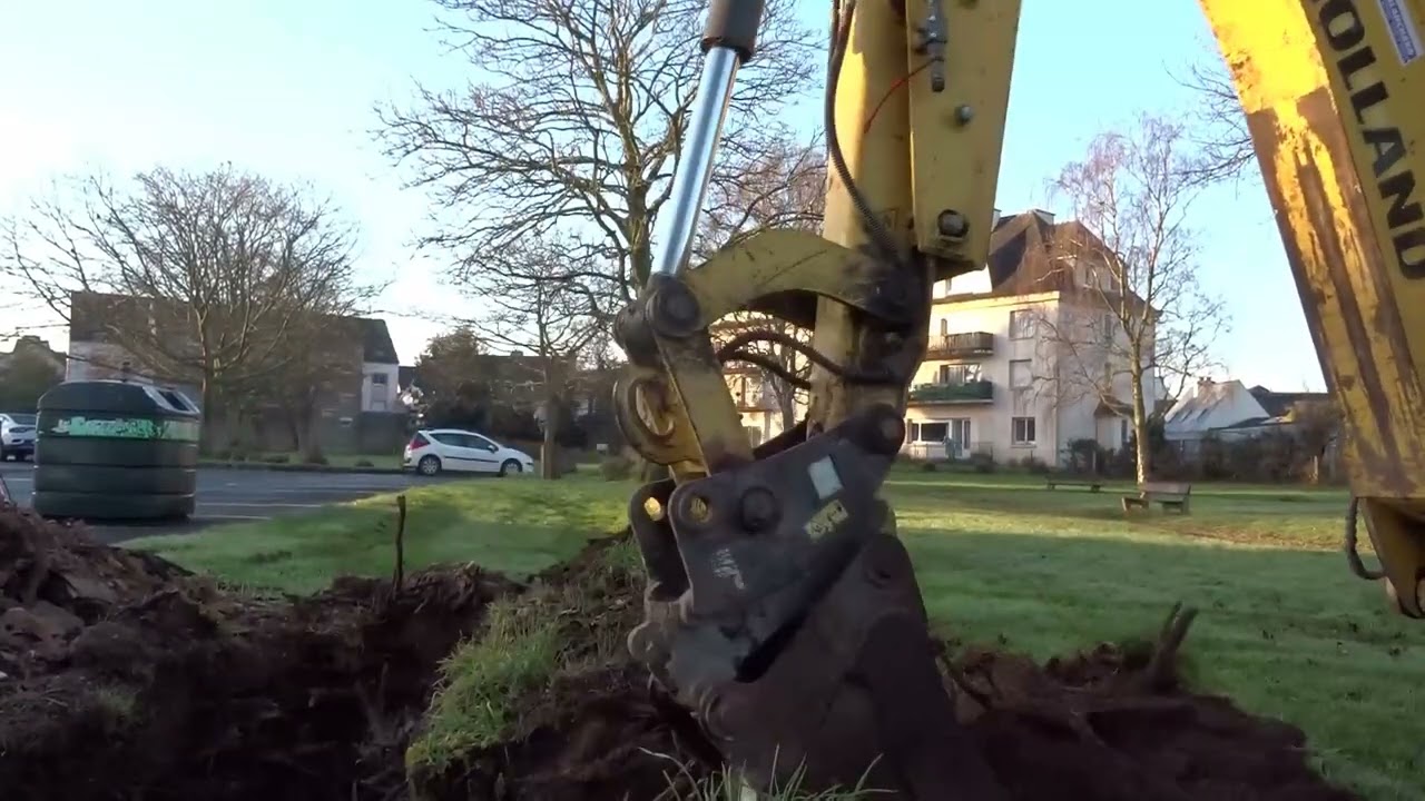 tracto new holland b 110 c arrachage souche .