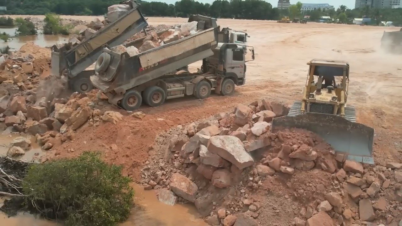 Updating Big Land Filling Process By Powerful Dozer Moving Rock & Dump Truck Huge Rock
