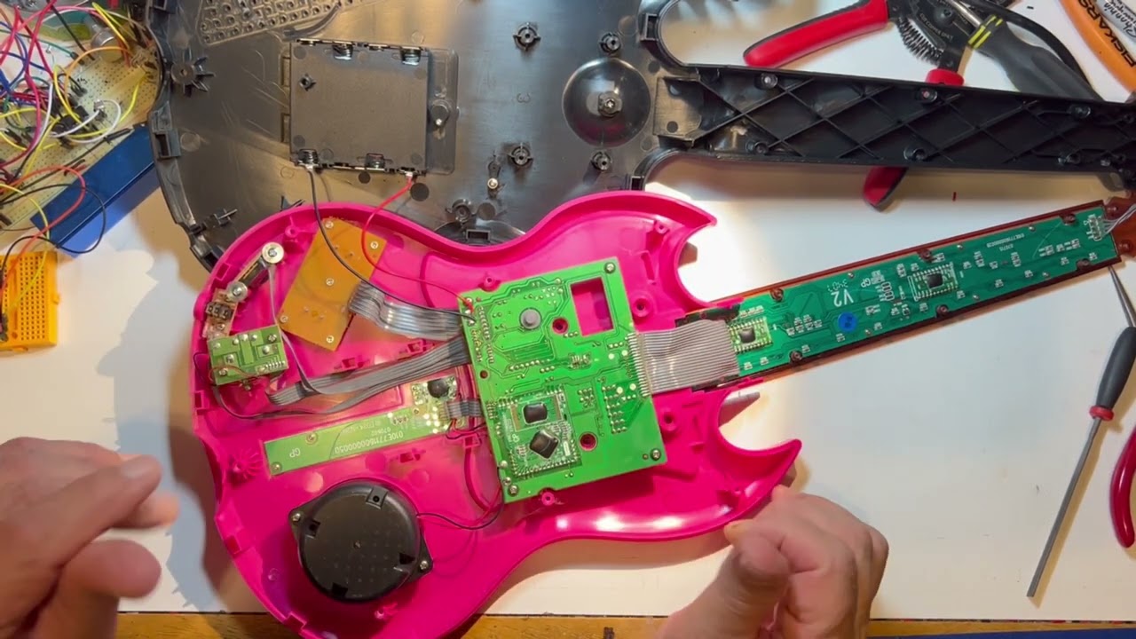 The weird act of circuit bend exploration. In this case a Gibson Power Tour Hasbro guitar.