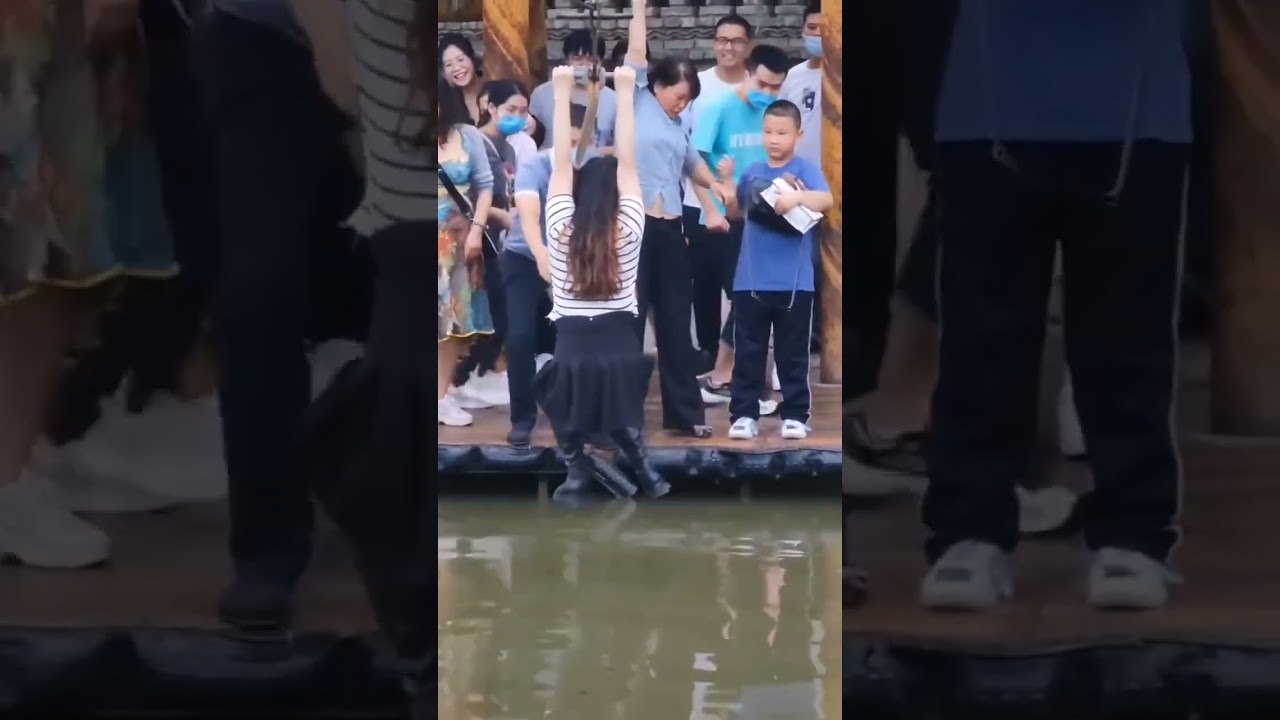 She playing zipline on water wear high boots viewB