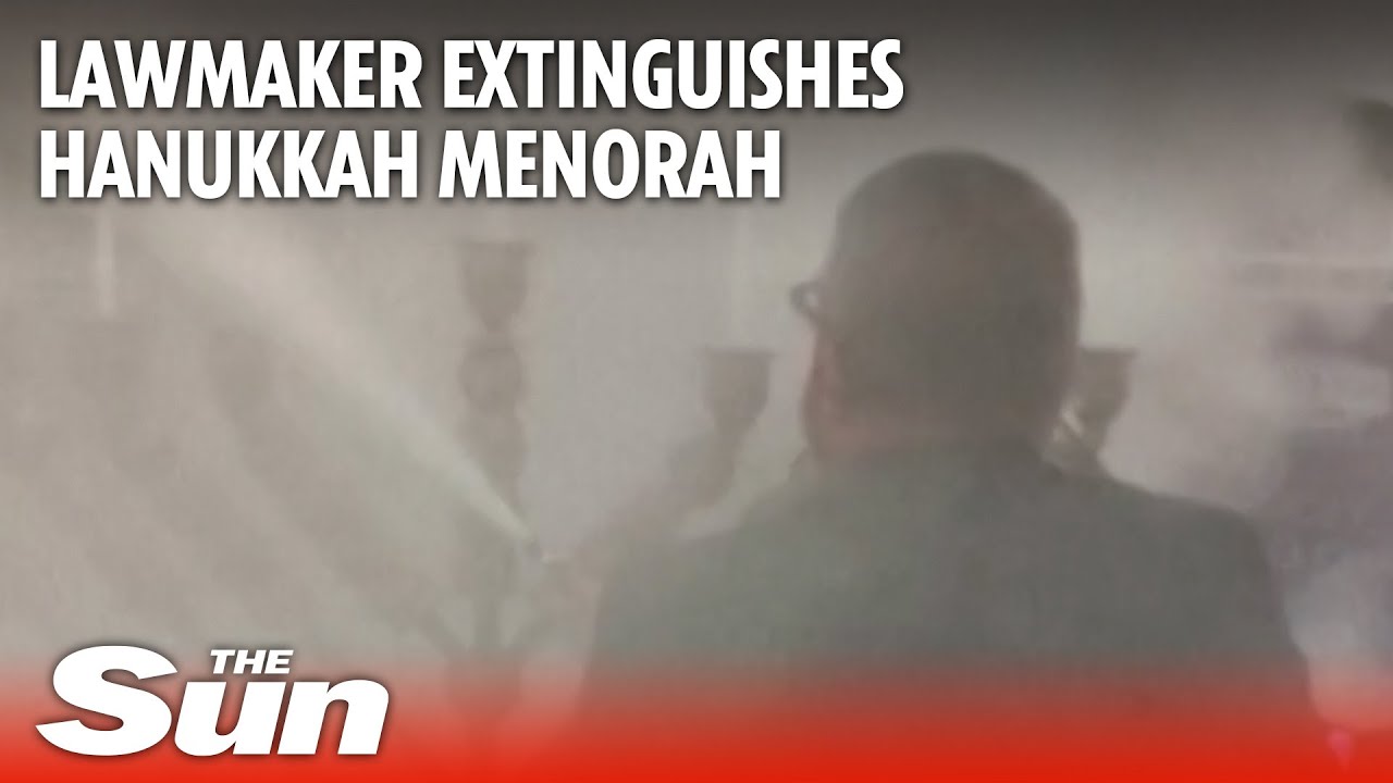 Shocking moment far-right Polish lawmaker uses fire extinguisher on Hanukkah candles