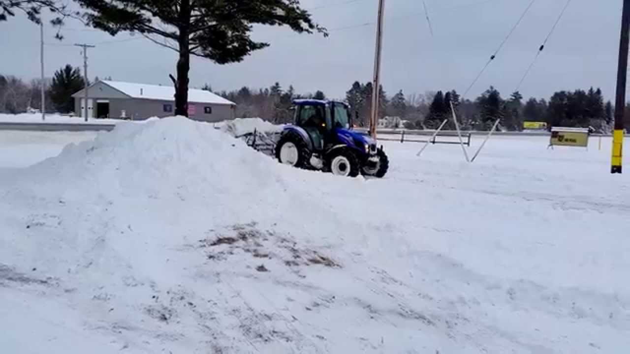 New Holland 4.75 Plowing Snow