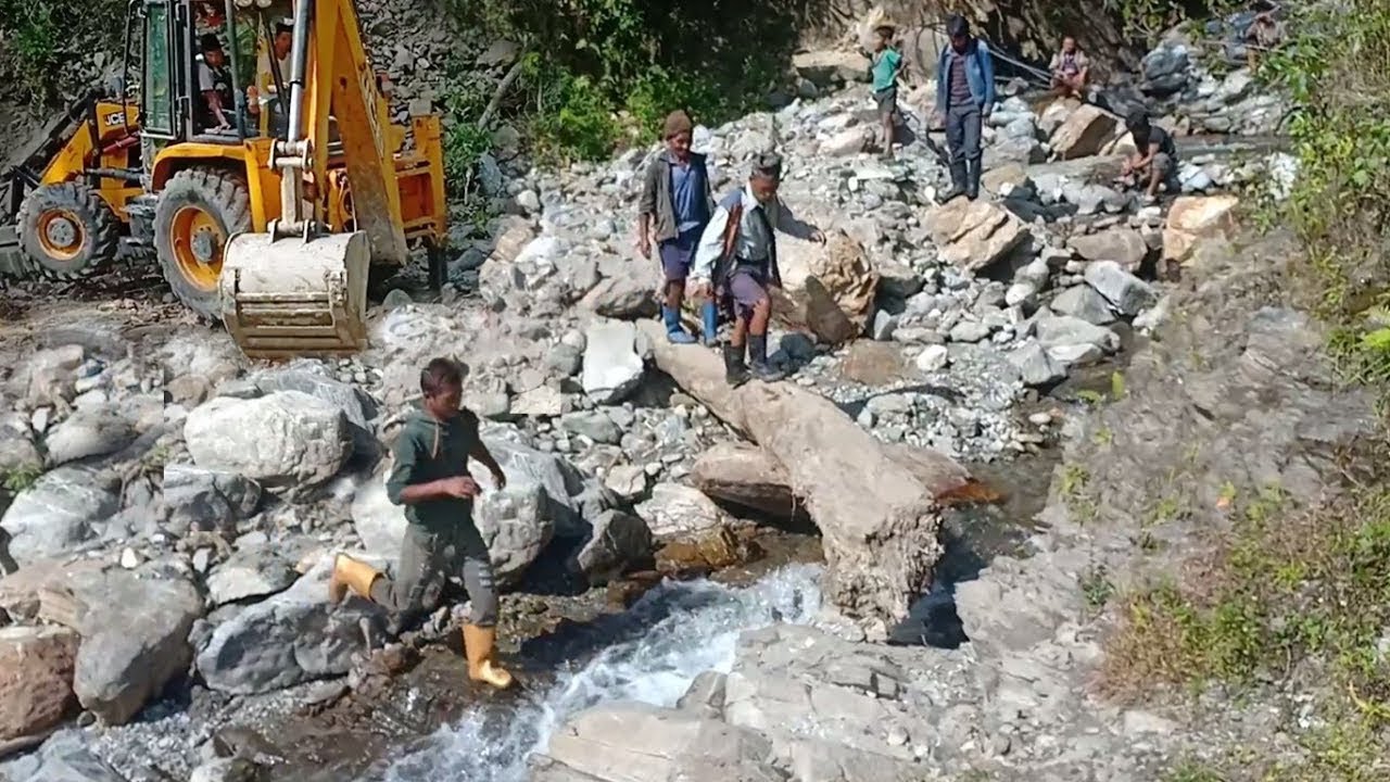 Mountain Village Road Bridging Temporarily Across Stream River-Connecting Two Villages