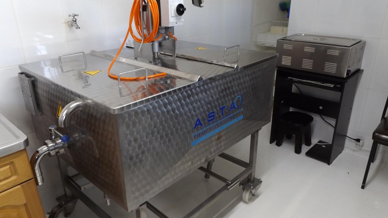 Stephen Cope, Cheese maker in Colombia shows his cheese vat